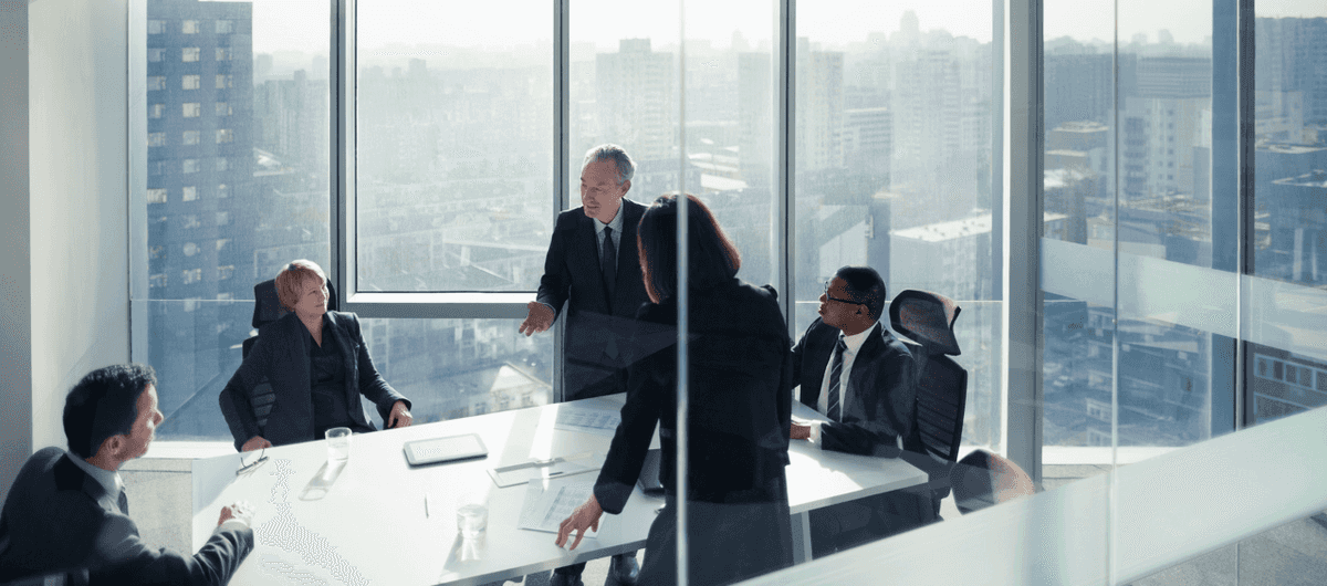 Company meeting with background view of the city